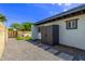 Exterior view showcasing backyard shed, landscaping, and gravel at 3710 E Altadena Ave, Phoenix, AZ 85028