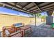 Relaxing backyard patio with pavers, seating, and a covered pergola at 3710 E Altadena Ave, Phoenix, AZ 85028