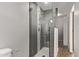 This remodeled walk-in shower features clean glass doors and dark grey tiling at 3710 E Altadena Ave, Phoenix, AZ 85028