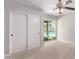 This bedroom features carpet, sliding closet doors, and sliding glass doors leading to the pool area at 3710 E Altadena Ave, Phoenix, AZ 85028