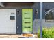 Inviting home featuring a vibrant green front door, white brick accents, and modern exterior lighting at 3710 E Altadena Ave, Phoenix, AZ 85028