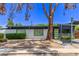 Contemporary home featuring a white brick facade, green door, and professionally landscaped front yard at 3710 E Altadena Ave, Phoenix, AZ 85028