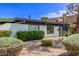 Well-maintained home featuring white brick, manicured shrubbery, and a gravel yard for easy care at 3710 E Altadena Ave, Phoenix, AZ 85028