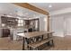 Modern kitchen with stainless steel appliances, granite countertops, and breakfast bar with seating at 3710 E Altadena Ave, Phoenix, AZ 85028