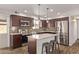 Modern kitchen features stainless steel appliances, granite countertops, and wooden cabinetry at 3710 E Altadena Ave, Phoenix, AZ 85028
