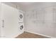 Convenient laundry room with stacked washer/dryer and storage shelves at 3710 E Altadena Ave, Phoenix, AZ 85028