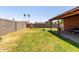 Expansive backyard with a covered patio, block fence, and plenty of space to enjoy at 3723 W Columbine Dr, Phoenix, AZ 85029