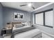 Serene bedroom with a comfortable bed, large window, and calming neutral tones at 3723 W Columbine Dr, Phoenix, AZ 85029