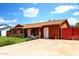 Charming single-story home features a well-maintained front yard with lush green grass and a spacious driveway at 3723 W Columbine Dr, Phoenix, AZ 85029