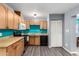 Bright kitchen featuring wood cabinets, modern appliances, and wood-style flooring at 3723 W Columbine Dr, Phoenix, AZ 85029