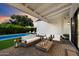 Charming backyard patio with an inviting seating area and a refreshing pool at 3808 E Fairmount Ave, Phoenix, AZ 85018