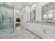Elegant bathroom featuring marble countertops, dual sinks, and a frameless glass shower showcasing luxurious finishes at 3808 E Fairmount Ave, Phoenix, AZ 85018