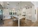 Bright and spacious kitchen with modern appliances, white cabinetry, and a marble countertop island at 3808 E Fairmount Ave, Phoenix, AZ 85018