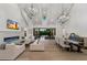 Spacious living room with high ceilings, a fireplace, and access to the outdoor patio at 3808 E Fairmount Ave, Phoenix, AZ 85018