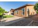 Well-maintained backyard featuring a patio, artificial grass, and desert landscaping at 3894 E Dogwood Pl, Chandler, AZ 85286