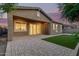 Outdoor patio featuring a brick paver design and a small patch of green grass at 3894 E Dogwood Pl, Chandler, AZ 85286