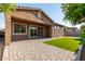 Beautiful backyard featuring a covered patio, artificial grass, and desert landscaping at 3894 E Dogwood Pl, Chandler, AZ 85286