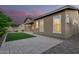Outdoor patio featuring a brick paver design and a small patch of green grass at 3894 E Dogwood Pl, Chandler, AZ 85286