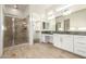Bright primary bathroom featuring double sinks, granite countertops, and a separate tiled shower at 3894 E Dogwood Pl, Chandler, AZ 85286