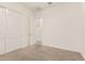 Comfortable bedroom with neutral carpet, a closet with sliding doors, and easy access to other rooms at 3894 E Dogwood Pl, Chandler, AZ 85286