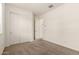 Cozy bedroom with neutral carpet, a closet with sliding doors, and easy access to other rooms at 3894 E Dogwood Pl, Chandler, AZ 85286