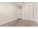 Clean, carpeted bedroom with white walls and closet providing a blank canvas to make your own at 3894 E Dogwood Pl, Chandler, AZ 85286