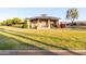 A well-maintained clubhouse surrounded by lush green grass and manicured landscaping at 3894 E Dogwood Pl, Chandler, AZ 85286