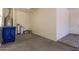 A spacious garage with ample storage space, utility connections, and access to the home at 3894 E Dogwood Pl, Chandler, AZ 85286