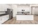 Bright kitchen featuring white cabinetry, stainless steel appliances, and a center island at 3894 E Dogwood Pl, Chandler, AZ 85286