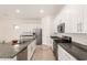 Spacious kitchen with white cabinets, stainless steel appliances, granite countertops, and a central island at 3894 E Dogwood Pl, Chandler, AZ 85286