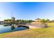 Scenic view of a pond with a gazebo, pier, and surrounding green space at 3894 E Dogwood Pl, Chandler, AZ 85286