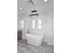 Bright bathroom featuring a modern tub, decorative chandelier, and plantation shutters for natural light at 3931 E Crest Ln, Phoenix, AZ 85050