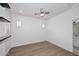 Modern bedroom with wood floors, recessed lighting, and white plantation shutters at 3931 E Crest Ln, Phoenix, AZ 85050