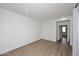 Spacious bedroom featuring light wood floors and white walls at 3931 E Crest Ln, Phoenix, AZ 85050