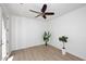 Bright, inviting room with wood-look floors, a modern fan and a beautiful entryway at 3931 E Crest Ln, Phoenix, AZ 85050