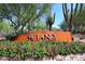 Attractive community entrance with lush landscaping and decorative signage at 3931 E Crest Ln, Phoenix, AZ 85050