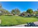 Well-manicured community park with lush green grass, mature trees, and a picnic pavilion at 3931 E Crest Ln, Phoenix, AZ 85050