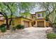Beautiful home exterior with well-maintained landscaping, a paver driveway, and a tile roof at 3931 E Crest Ln, Phoenix, AZ 85050