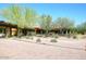 Beautifully landscaped exterior with desert plants, manicured bushes, and a covered entry way at 3931 E Crest Ln, Phoenix, AZ 85050