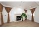Living room showcasing fireplace feature, natural light, and hardwood floors at 3931 E Crest Ln, Phoenix, AZ 85050