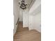 Bright foyer with wood floors, staircase, chandelier, and high ceilings at 3931 E Crest Ln, Phoenix, AZ 85050