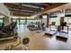 Community gym with high ceilings, exposed ductwork, floor to ceiling windows, and cardio equipment at 3931 E Crest Ln, Phoenix, AZ 85050