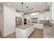 Modern kitchen showcasing an island, granite countertops, and stainless steel appliances at 3931 E Crest Ln, Phoenix, AZ 85050
