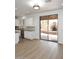 Kitchen with stainless steel appliances, white cabinetry, and sliding glass doors to outdoor fireplace at 3931 E Crest Ln, Phoenix, AZ 85050