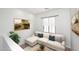 Comfortable seating area featuring a chaise lounge, decorative pillows, and a view of the exterior at 3931 E Crest Ln, Phoenix, AZ 85050