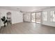 Large living room with light wood flooring, recessed lights, and access to the outdoors at 3931 E Crest Ln, Phoenix, AZ 85050