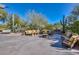 Outdoor patio area with comfortable seating, decorative tables, cacti, and lots of natural light at 3931 E Crest Ln, Phoenix, AZ 85050