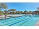 Gorgeous community pool area with lap swimming lanes and lounge seating at 3931 E Crest Ln, Phoenix, AZ 85050