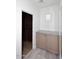 View into a walk-in closet from an adjacent room with a built in counter at 3931 E Crest Ln, Phoenix, AZ 85050