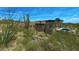 Contemporary house boasts a backyard with a swimming pool, seating and outdoor fireplace at 39878 N 105Th Way, Scottsdale, AZ 85262